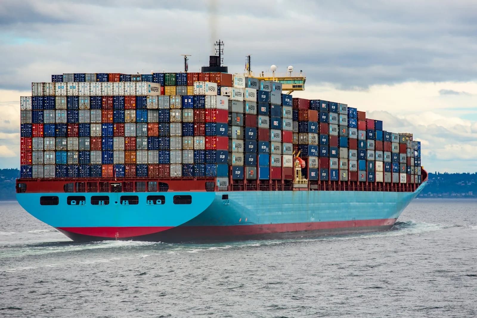 A fully laden container ship under way at sea