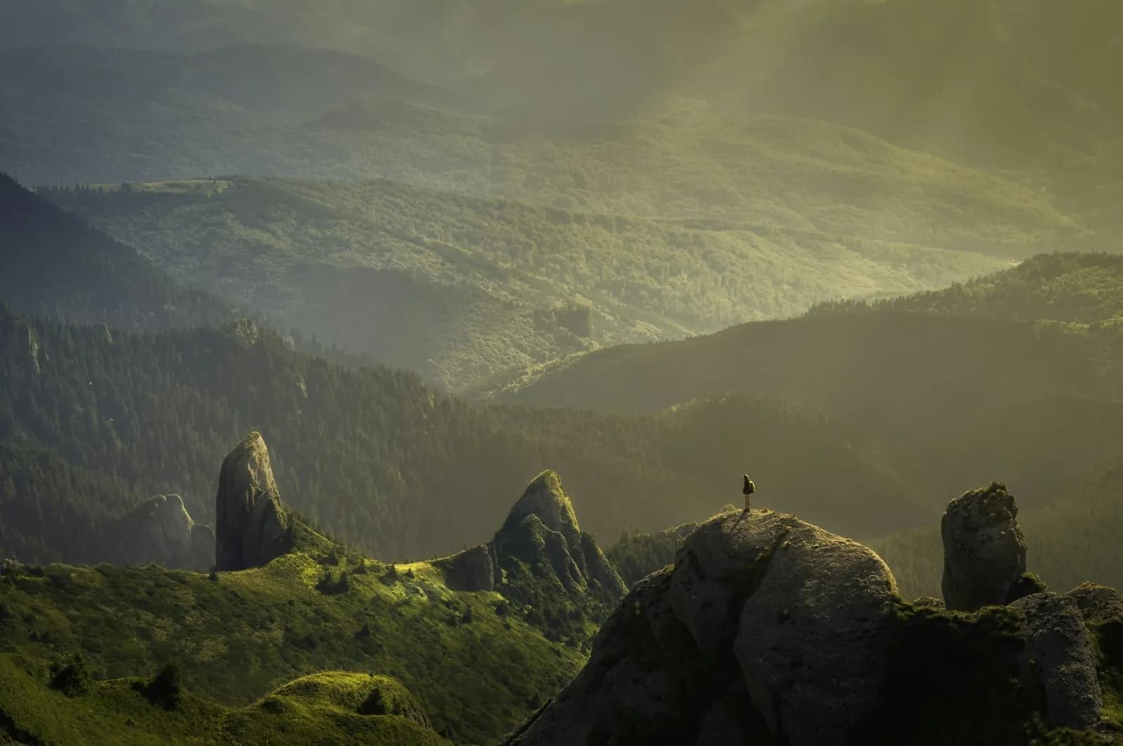 Layered mountain ranges receding into mist